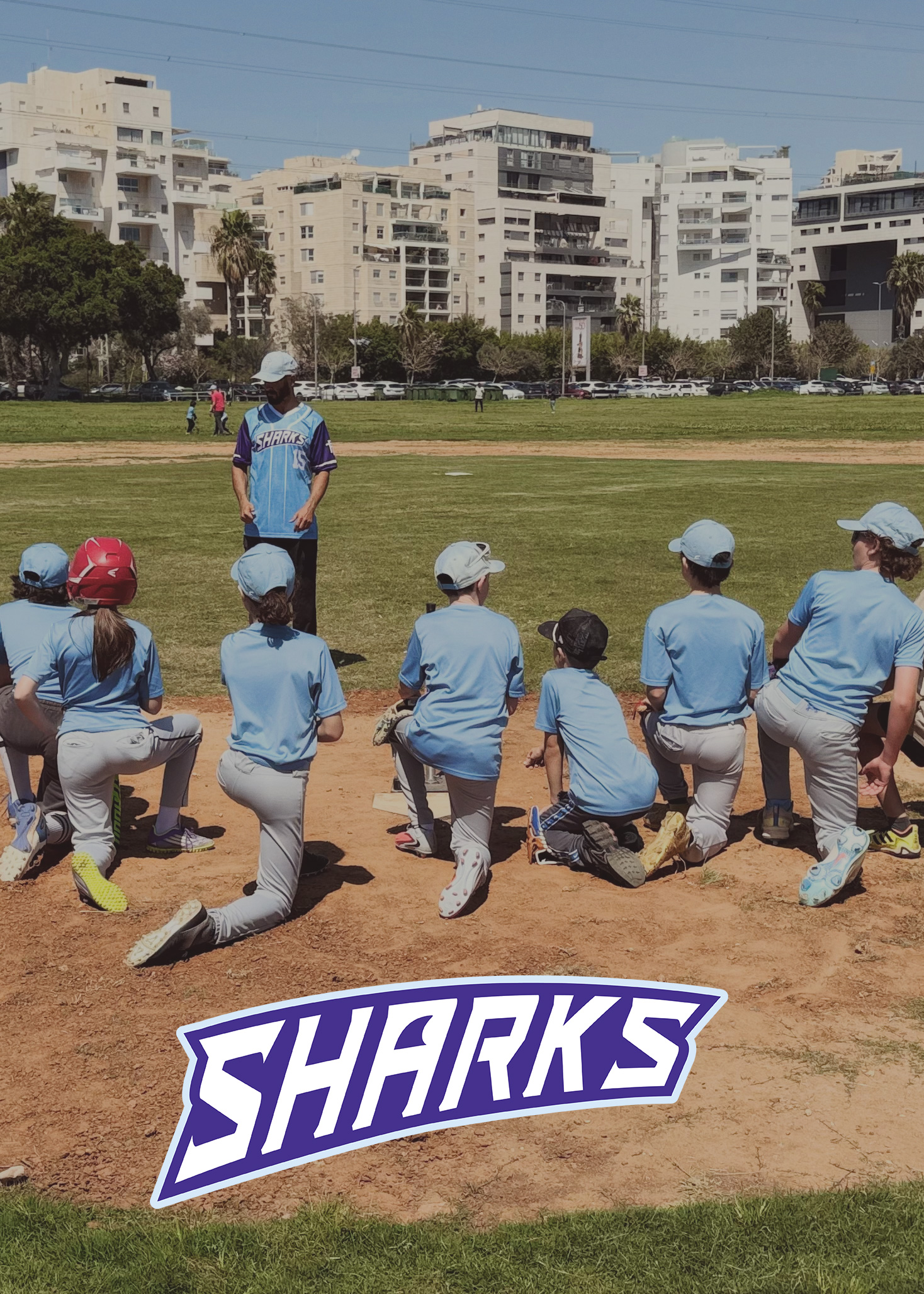 Youth players participating in a Tel Aviv Baseball league game.
